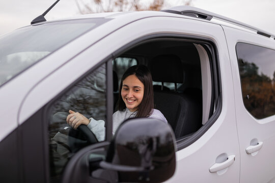 teenage girl driving a van