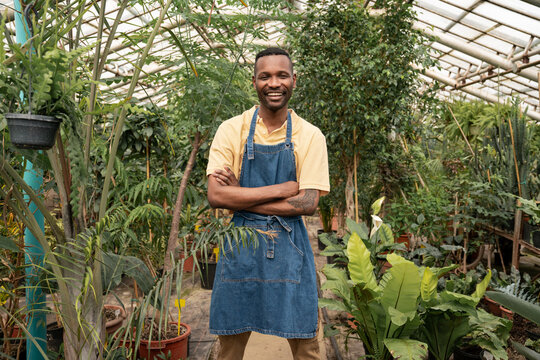 Portrait Of Smiling Greenhouse Worker