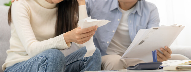 Stressed financial owe asian young couple love sitting suffer, stressed and confused by calculate...