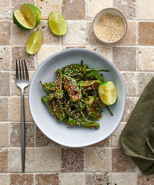 Bowl of Padron peppers with sesame seeds