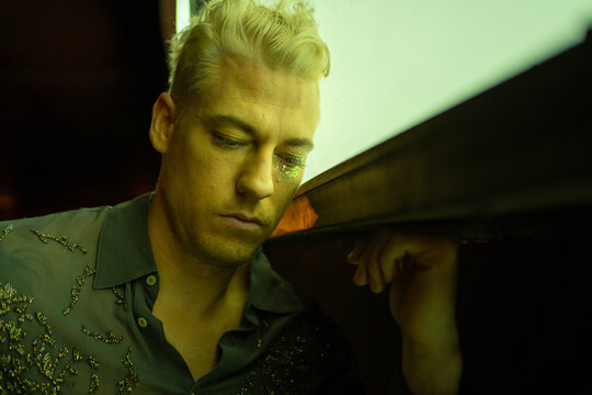 Portrait Of A LGBTQ Man With Mental Anxiety At Night. - Powered by Adobe