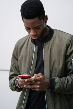 Black man texting on cellphone