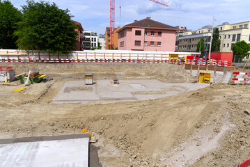 Foundation ditch at construction site at City of Zürich on a blue cloudy spring day. Photo taken...