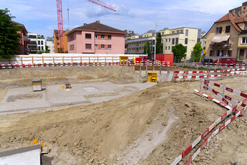 Foundation ditch at construction site at City of Zürich on a blue cloudy spring day. Photo taken...
