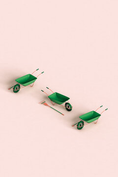 three green rake and wheelbarrow with copy space