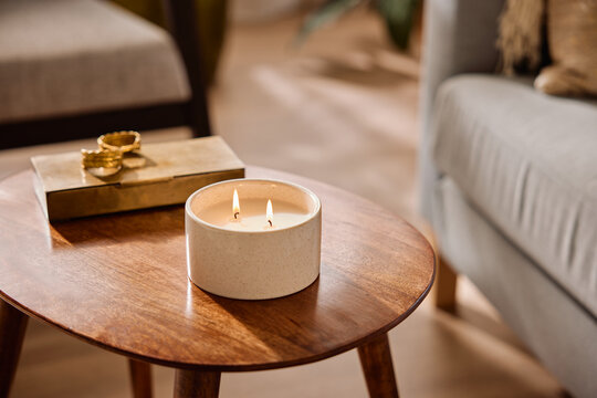 Ceramic cup with candle near box