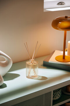 Cabinet with reed diffusers and decorations