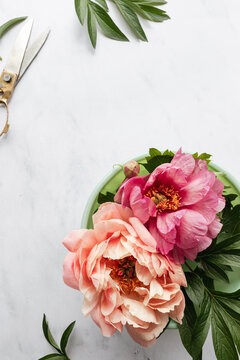 centerpiece of pink and coral peonies 