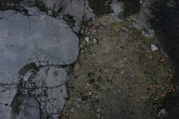 The shadow of the old gray cement wall surface with cracks

