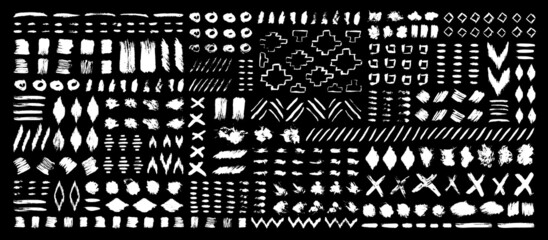 Grunge design elements set. Grunge shapes collection for patterns or backdrops. Paint stains and brush strokes. Tribal ethnic style. Grungy ink spots and drops.