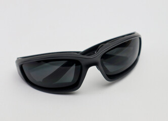 black sport sunglasses isolated white background selective focus