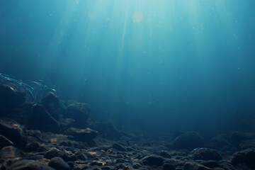 sun rays under water blue ocean background, abstract sun light in water wallpaper - obrazy, fototapety, plakaty