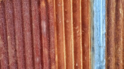 Beautiful rusty corrugated iron metal fence zinc wall texture. Architecture and building background design. Suitable for poster, backdrop, wallpaper, website, advertising of company and industry, etc.