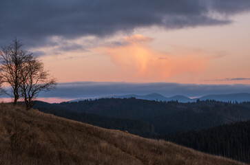 Picturesque pre sunrise morning above late autumn mountain countryside. Ukraine, Carpathian Mountains. Peaceful traveling, seasonal, nature and countryside beauty concept scene.