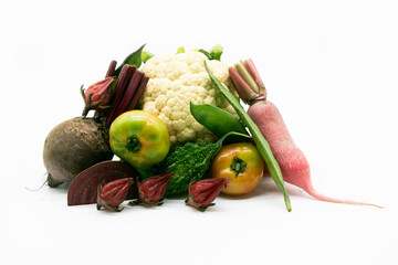 Different types of vegetable over on white background .Beet, tomato and bitter melon