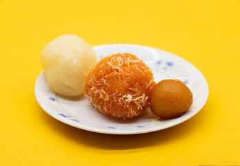 Rasgulla isolate on yellow background.