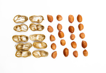 Unpeeled and peeled peanuts isolated on white background. Top view.