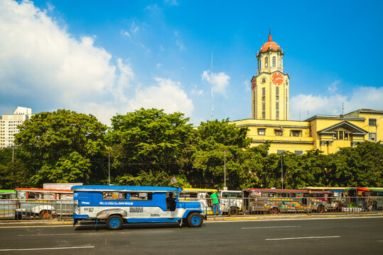 April 8, 2019: Clock tower of Manila City Hall with jeepney. The clock tower, in the historic center of Ermita, Manila, philippines, was designed by Antonio Toledo and completed during the 1930s.