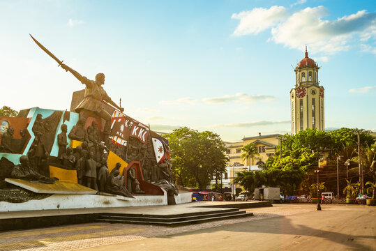 Manila, Philippines - April 6, 2020: Bonifacio and the Katipunan Revolution Monument and clock tower of the Manila City Hall in Bonifacio Shrine, commemorates Andres Bonifacio.