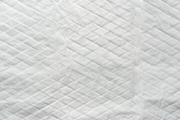 Fototapeta premium closeup white and soft baby cloth crumpled diapers or disposable flat bed sheet with square background and texture