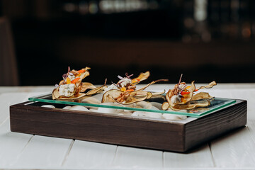 Dried fruit sliced Pear chips with cottage cheese and walnuts - healthy vegan dessert sugar free, served for furshet in restaurant