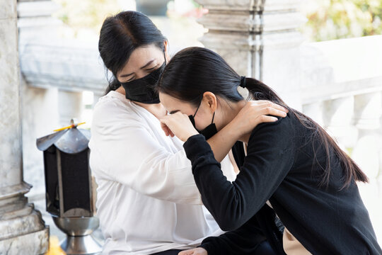 Sad Daughter With Understanding Mother In Religious Service