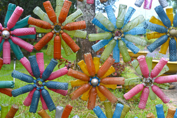 Flower shaped colourful decorations made of plastic bottles