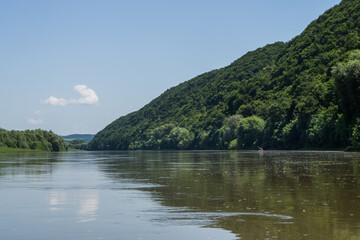 Dniester. Ivano-Frankivsk region. June 20, 2019; A group of tourists floating in a canoe on the...