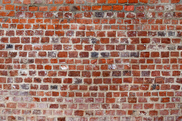Red old brick wall background.