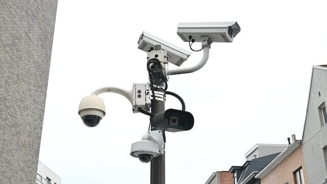 CCTV camera on the pole. Professional Security cameras scanning the street. Recording video with cam in 4K. Surveillance, privacy, criminal, technology, spy, equipment, protection and safety concept.
