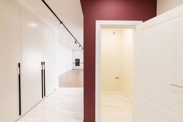 light corridor interior with red wall