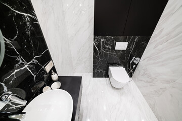 interior design of a bathroom with light and dark tiles in a new house
