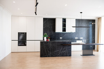 interior design of a new kitchen with dark and light furniture