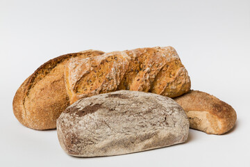 Homemade natural breads. Different kinds of fresh bread as background, perspective view with copy space