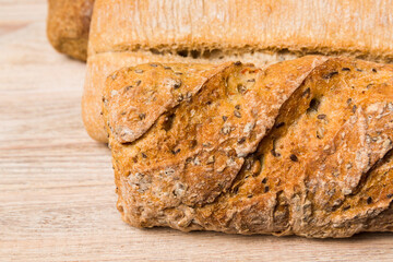 Homemade natural breads. Different kinds of fresh bread as background, perspective view with copy space