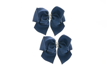 Blue satin bow for hair for girl, woman isolated on white background. Scrunchie hair clip accessory...