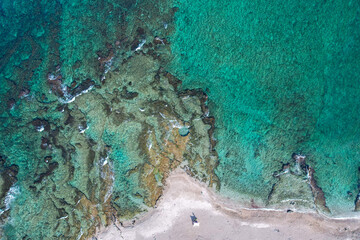 A natural pool is hewn in a natural rock near the shoreline of Haifa, Israel.