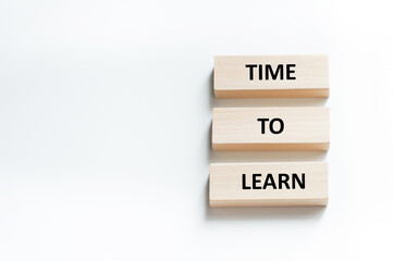 Time to Learn on wooden blocks put black. Education concept. Life-time learning business concept.