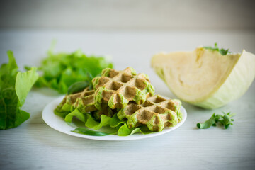 vegetable waffles cooked with herbs in a plate