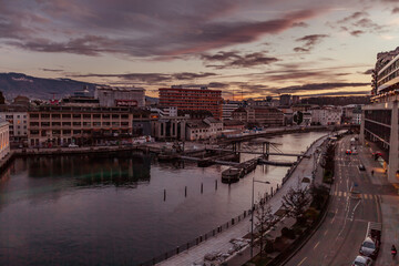 GENEVA, SWITZERLAND - February 20, 2022: Night traffice on Quai du Seujet street, North side of the Rhone channel.