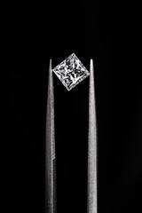 Princess cut diamond with tweezers