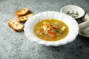 Homemade vegetable soup with smoked bacon