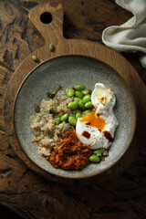 Healthy quinoa bowl with poached egg
