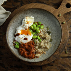 Healthy quinoa bowl with poached egg