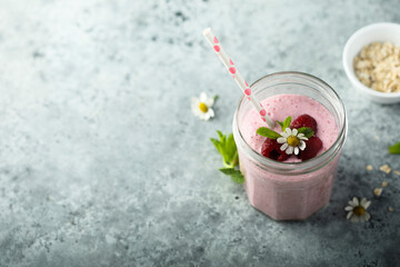 Healthy raspberry smoothie in the jar