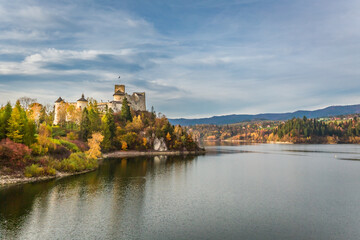 Fototapeta premium Niedzica castle by the lake in autumn, Poland