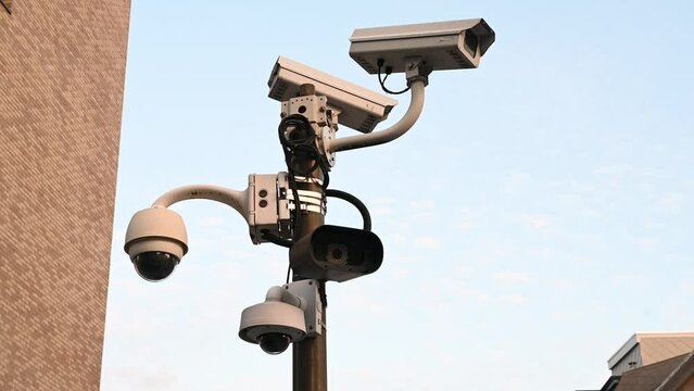 CCTV camera on the pole. Professional Security cameras scanning the street. Recording video with cam in 4K. Surveillance, privacy, criminal, technology, spy, equipment, protection and safety concept.