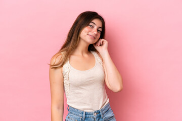 Young caucasian woman isolated on pink background laughing