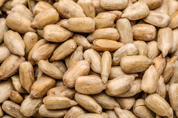 Closeup view of peeled sunflower seeds as background