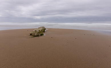 NORTH BEACH WITH LOW TIDE AND CLOUDY SPRING SKY